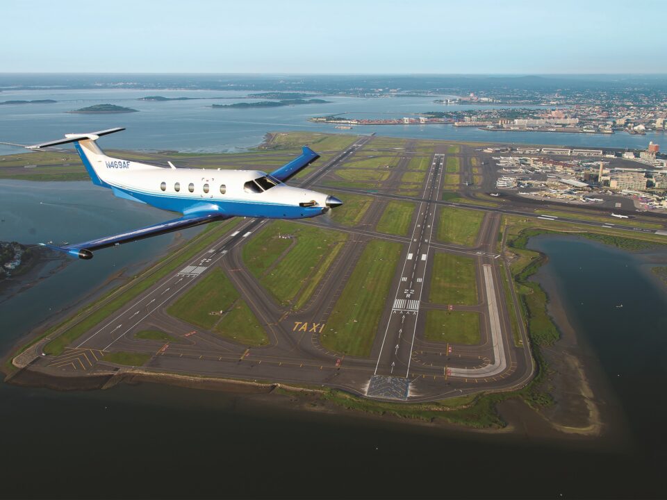 PlaneSense PC-12 flying over Boston.