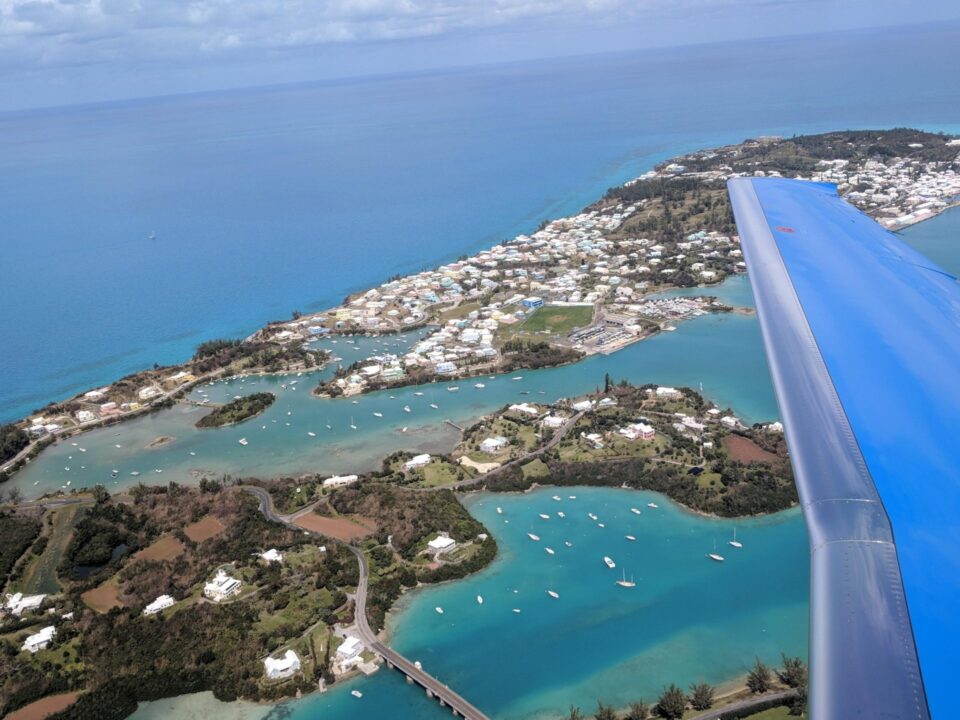 PlaneSense aircraft flying over Bermuda.