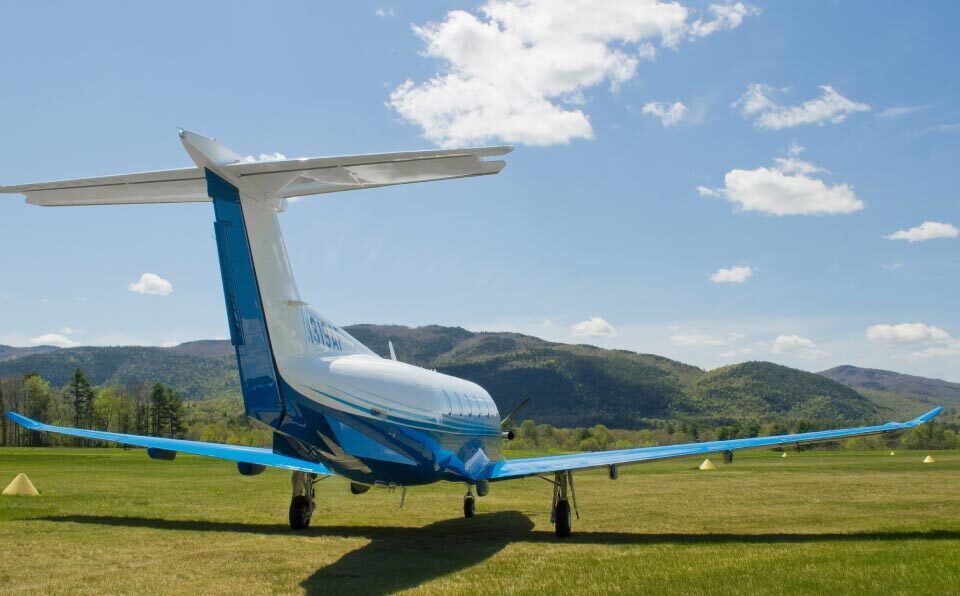 Pilatus PC-12 on a grass runway